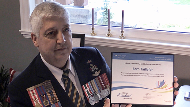 Fern Taillefer, of Oro-Medonte, Ont., holds his national award for his dedication to working with veterans on Wed., Nov. 30, 2022 (CTV News/Alessandra Carneiro)