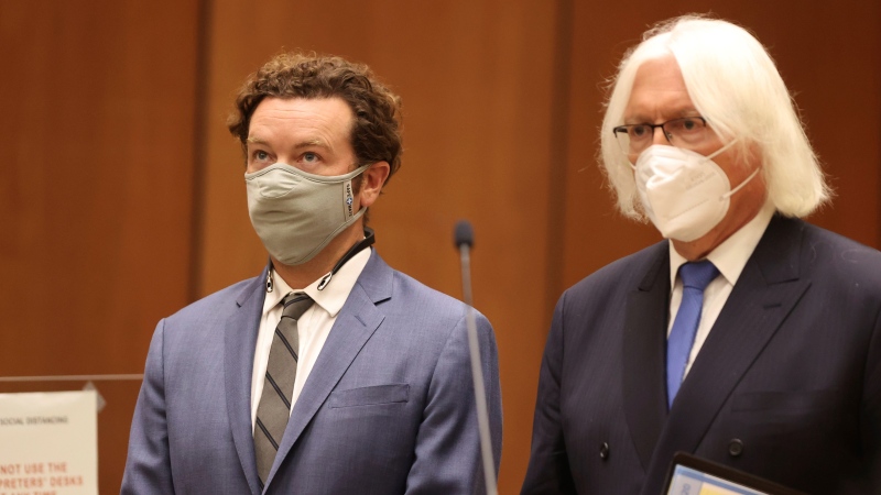Actor Danny Masterson, left, stands with his attorney, Thomas Mesereau, as he is arraigned on rape charges at Los Angeles Superior Court, in Los Angeles, Calif. on Friday, Sept. 18, 2020. (Lucy Nicholson/Pool Photo via AP) 