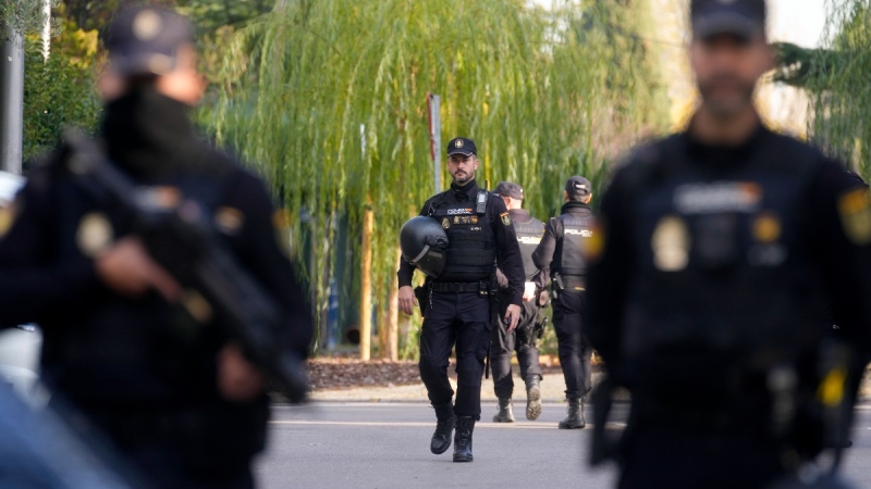 Police officers stand guard as they cordon off the area next to the Ukrainian embassy in Madrid, Spain, on Nov. 30, 2022. (Paul White / AP) 