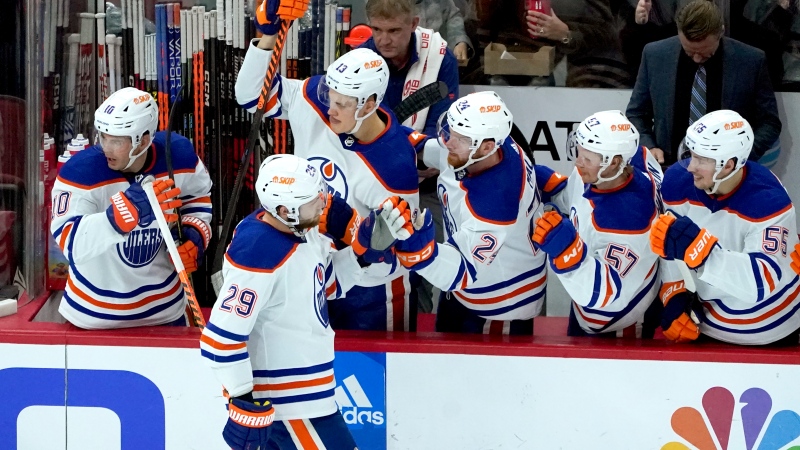 Edmonton Oilers' Leon Draisaitl (29) celebrates his goal with teammates during the second period of an NHL hockey game against the Chicago Blackhawks Wednesday, Nov. 30, 2022, in Chicago. (AP Photo/Charles Rex Arbogast)
