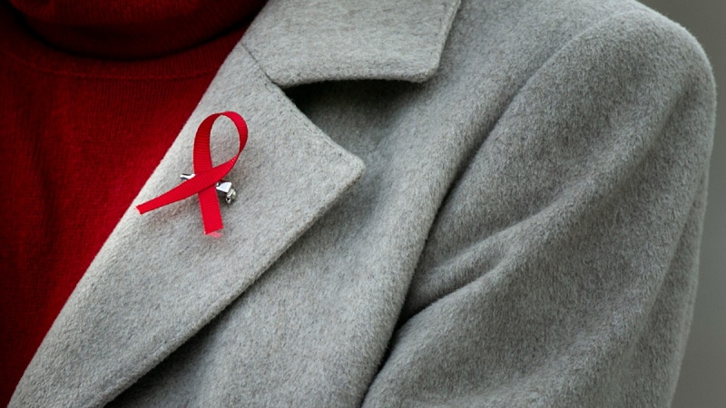 A red ribbon worn to mark World AIDS Day, on Dec. 1, 2021. (Joseph Cress / Iowa City Press-Citizen via AP) 