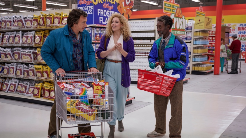 This image released by Netflix shows Adam Driver, from left, Greta Gerwig, and Don Cheadle in a scene from "White Noise." (Wilson Webb/Netflix via AP)