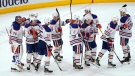 The Edmonton Oilers celebrate the team's 5-4 win over the Chicago Blackhawks in an NHL hockey game Wednesday, Nov. 30, 2022, in Chicago. (AP Photo/Charles Rex Arbogast)