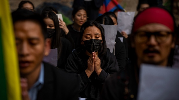 Exile Tibetan activists pray at the end of an anti-China protest in New Delhi, India, on Dec. 2, 2022. (Altaf Qadri / AP) 