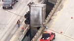 Truck dangles off overpass in Indiana