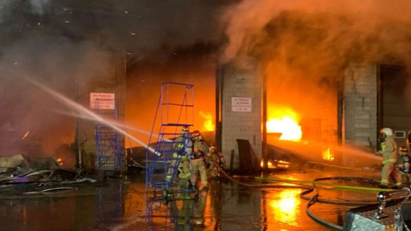 Firefighters battle a massive blaze at an industrial site in Bracebridge, Ont., on Thurs., Dec. 1, 2022. (Twitter/Town of Bracebridge)