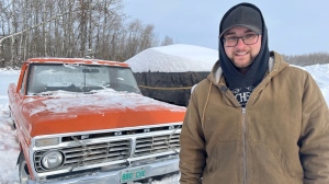Sean Ebel stands in front of his grandpa's classic Ford F100. (Stacey Hein/CTV News) 