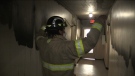 Lead fire inspector Chris Rennie explains how fire did not spread along an apartment corridor because tenants closed their doors when they evacuated in London, Ont. on Friday, Dec. 2, 2022. (Bryan Bicknell/CTV News Windsor)