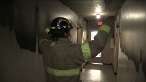 Lead fire inspector Chris Rennie explains although smoke spread through the main hallway, fire did not spread along the main corridor because tenants closed their doors when they evacuated in London, Ont. on Friday, Dec. 2, 2022. (Bryan Bicknell/CTV News Windsor)