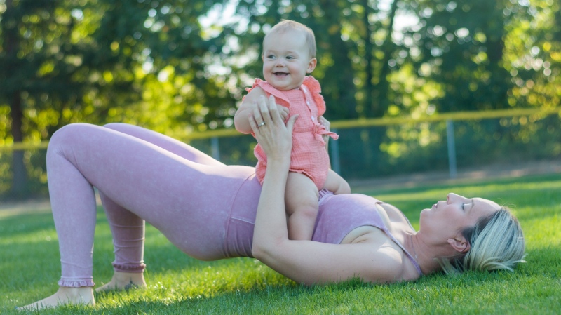 Mother exercises with baby (Pexels/Loren Castillo)
