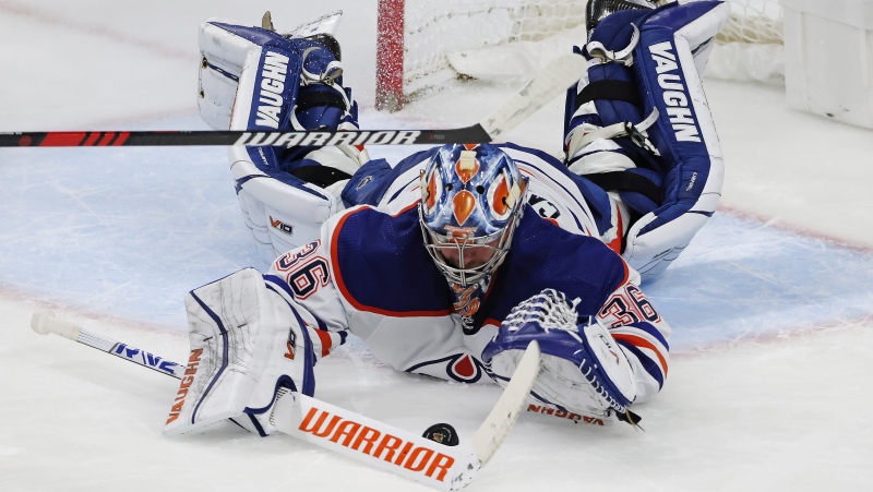 Edmonton Oilers goaltender Jack Campbell (36) blocks a shot by the Minnesota Wild during the third period of an NHL hockey game Thursday, Dec. 1, 2022, in St. Paul, Minn. (AP Photo/Stacy Bengs)