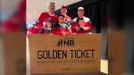 James Morrison (middle of the back row), his friends and their children pose with the Golden Ticket Morrison won at the 2022 World Juniors Hockey Championship in Edmonton. (Courtesy: James Morrison)  
