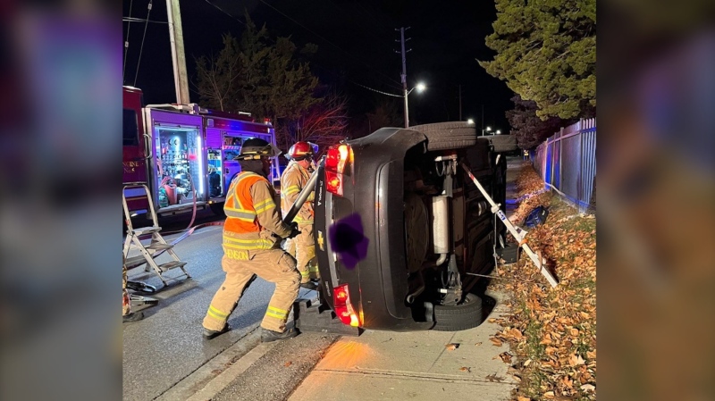 Firefighters rescued two people from their vehicle after a crash on Riverside Drive in London, Ont. in the early morning hours of Dec. 4, 2022. (Source: London Fire Department/Twitter)