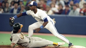 Toronto Blue Jays first baseman Fred McGriff tags out Oakland's Jose Canseco, May 21, 1990. The Canadian Press Images/Hans Deryk