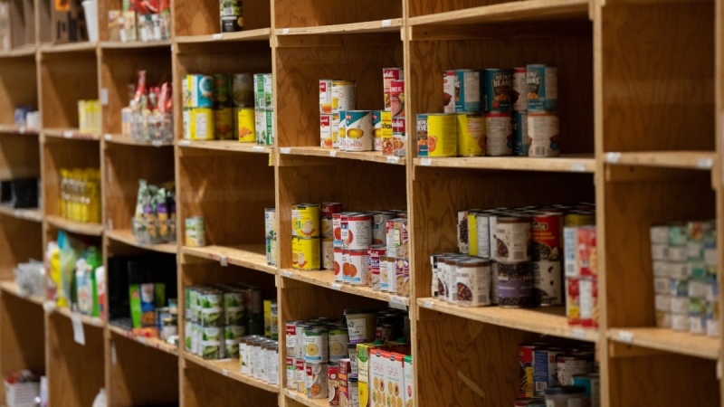 Canned products sit on shelves at the Kanata Food Cupboard, Oct. 7, 2022 in Ottawa. THE CANADIAN PRESS/Adrian Wyld