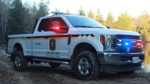 Ministry of Natural Resources and Forestry Conservation Officer's truck parked by an Ontario lake. (Supplied)
