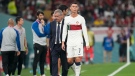 Portugal's Cristiano Ronaldo, center, passes beside his coach Fernando Santos as he leaves the field during the World Cup group H soccer match between South Korea and Portugal, at the Education City Stadium in Al Rayyan , Qatar, Friday, Dec. 2, 2022. (AP Photo/Lee Jin-man)