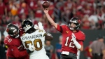 Tampa Bay Buccaneers quarterback Tom Brady (12) passes under pressure from New Orleans Saints defensive end Tanoh Kpassagnon (90) in Tampa, Fla., on Dec. 5, 2022. (Chris O'Meara / AP) 