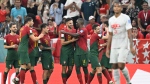 Portugal's forward #26 Goncalo Ramos, middle, celebrates with teammates after he scored his team's fifth goal during the Qatar 2022 World Cup round of 16 football match between Portugal and Switzerland at Lusail Stadium in Lusail, north of Doha on Dec. 6, 2022. (Photo by PATRICIA DE MELO MOREIRA/AFP via Getty Images)