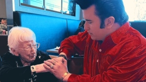 Jonathon Hicks sings to a woman celebrating her 104th birthday in B.C. in December of 2022. 