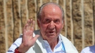 Spain's former King Juan Carlos waves before a reception at a nautical club prior to a yachting event in Sanxenxo, north western Spain, Friday, May 20, 2022. (AP Photo/Lalo R. Villar)