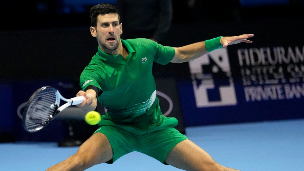 Novak Djokovic returns the ball