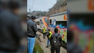 Passengers and railway staff are seen at the scene of a train collision in Montcada i Reixac, Spain, on Dec. 7, 2022. (Josep Jorge via AP)