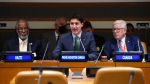 Prime Minister Justin Trudeau speaks as he sits with Canadian Ambassador to the United Nations Bob Rae at the United Nations during a meeting of the Ad Hoc Advisory Group and Caribbean partners on the situation in Haiti at the United Nations in New York on Wednesday, Sept. 21, 2022. THE CANADIAN PRESS/Sean Kilpatrick