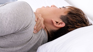 Don't sleep on your stomach if you want to avoid neck pain, experts say. (source: Adobe Stock via CNN)