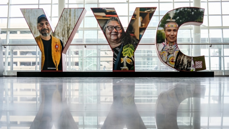 Faces of native Canadians appear on a 'YYC' sign at Calgary International Airport in Calgary, Alta., Monday, Oct. 10, 2022. (THE CANADIAN PRESS/Jeff McIntosh)