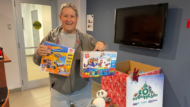 First-time donor to CTV's Toy Mountain, Mark Rainey, stopped by the station Wednesday with new and unwrapped donations.