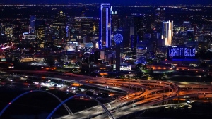 Buildings in the Dallas skyline are illuminated in blue Thursday, April 9, 2020. (Smiley N. Pool/The Dallas Morning News via AP) 