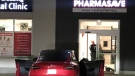 A Waterloo Regional Police Service officer at the scene of a reported robbery at a Kitchener pharmacy on Dec. 7, 2022. (Dan Lauckner/CTV Kitchener)