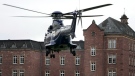 A police helicopter with a suspect arrives in Karlsruhe, Germany, on Dec. 7, 2022. (Michael Probst / AP)