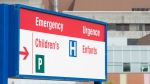A sign directing visitors to the emergency department is shown in Ontario. THE CANADIAN PRESS/Adrian Wyld