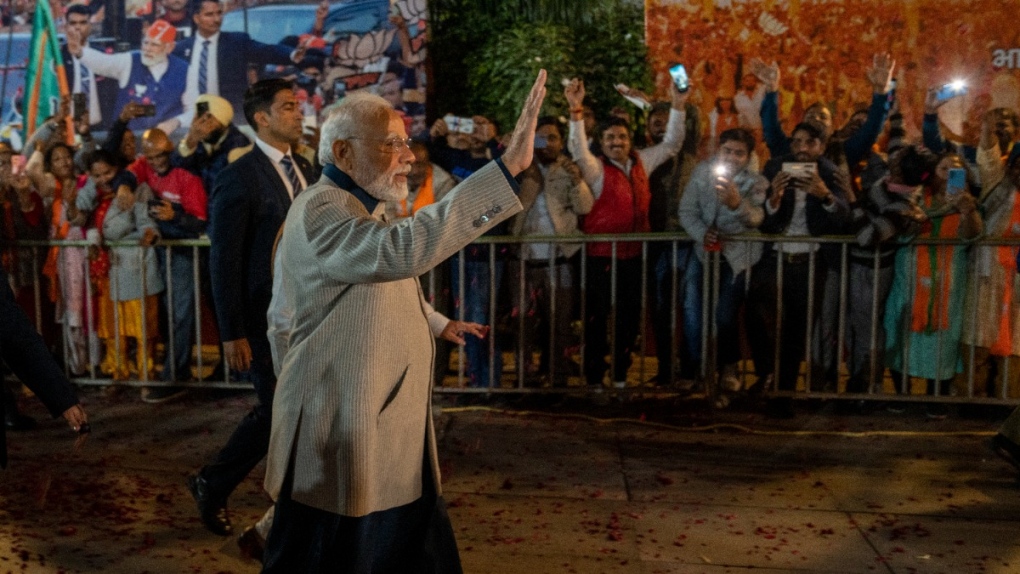 Indian Prime Minister Narendra Modi waves