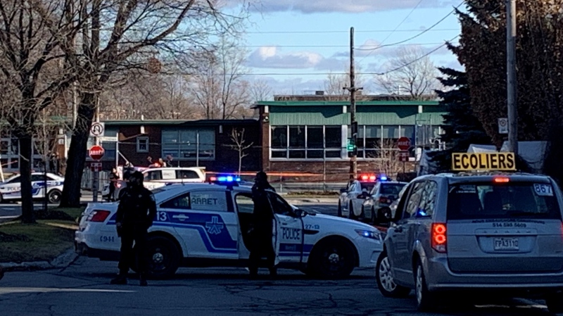 Montreal police set up a perimeter at Chenier and Saint Donat avenues near Chenier Primary School after a 16-year-old was shot with an airsoft gun on Dec. 8, 2022 (Angela MacKenzie, CTV News)