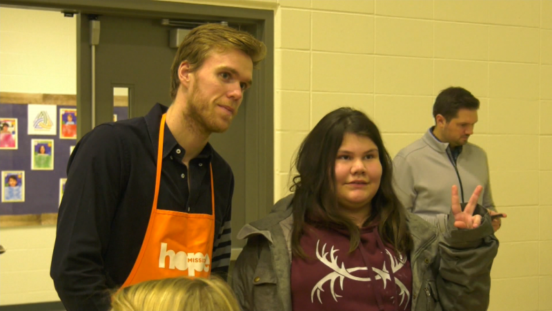 Connor McDavid poses for a photo at Hope Mission.