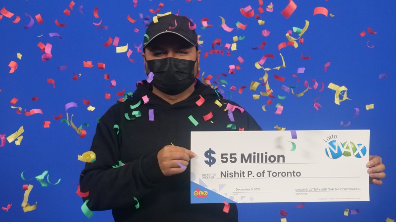 An image of Nishit Parikh with his Lotto Max cheque. (OLG) 