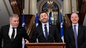 Parti Quebecois Leader Paul St-Pierre Plamondon sums up the fall session at a news conference, at the Legislature in Quebec City, Friday, Dec. 9, 2022. St-Pierre Plamondon is flanked by Parti Quebecois MNAs Pascal Berube, left, and Joel Arseneau. THE CANADIAN PRESS/Jacques Boissinot
