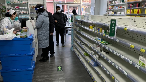 Empty shelves are seen in a pharmacy as customers tries to find medicine to prepare for a wave of COVID-19 outbreak in Beijing, on Dec. 13, 2022. (Ng Han Guan / AP) 