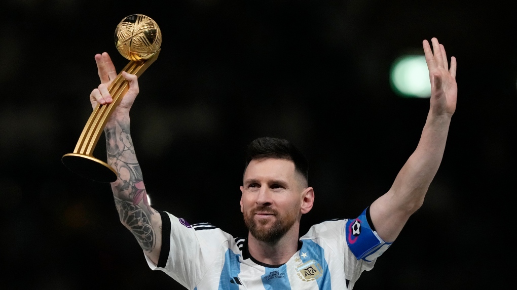 Lionel Messi waves after receiving the Golden Ball