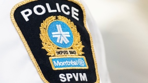 A Montreal police badge is shown during a news conference by Public Safety Minister Marco Mendicino in Montreal, Thursday, August 4, 2022, where he announced federal support for organizations on the front lines of the fight against gun and gang violence in Quebec. THE CANADIAN PRESS/Graham Hughes