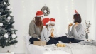 A family wearing masks at Christmas. (Pexels/Gustavo Fring)