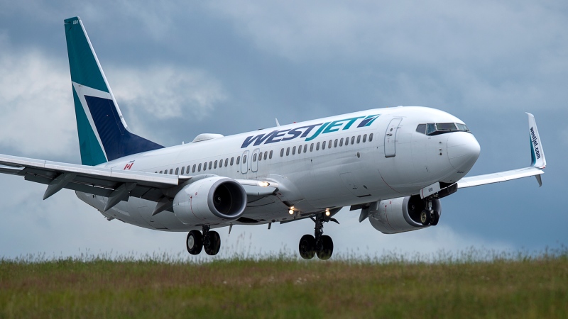 A WestJet flight from Calgary arrives at Halifax Stanfield International Airport in Enfield, N.S. on Monday, July 6, 2020. THE CANADIAN PRESS/Andrew Vaughan 