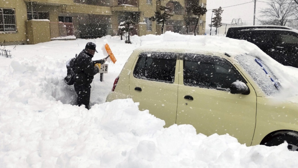 Shovelling snow in Hokkaido, Japan