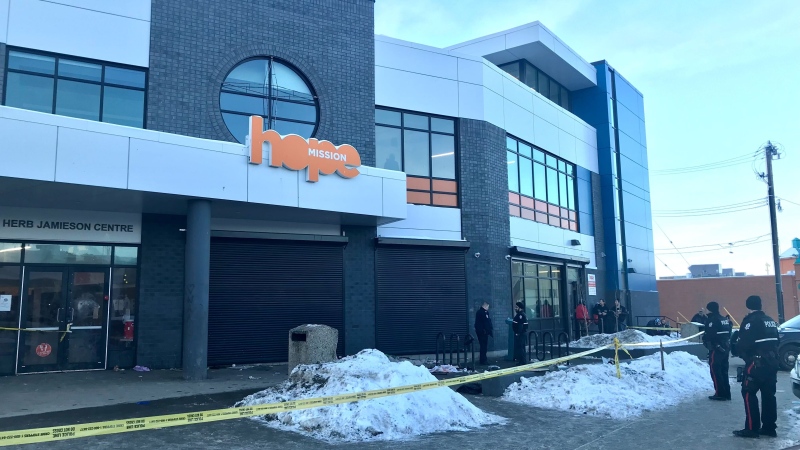 Officers were investigating in front of the Herb Jameison Shelter in central Edmonton on Monday, Jan. 2, 2022 (CTV News Edmonton/Evan Klippenstein).
