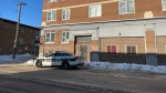 Winnipeg police remain on scene at the site of a fatal apartment fire on Jan 4, 2023. The fire, which occurred on Jan. 3, resulted in the death of a 23-year-old woman, and police are investigating the death as a homicide. (Image source: Jamie Dowsett/CTV News Winnipeg)