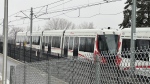 An Ottawa LRT car remains stopped near Lees Station, more than 16 hours after the vehicle stopped during freezing rain Jan. 4, 2023. (Jeremie Charron/CTV News Ottawa)