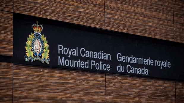 The RCMP logo is seen outside Royal Canadian Mounted Police "E" Division Headquarters, in Surrey, B.C., on Friday April 13, 2018. THE CANADIAN PRESS/Darryl Dyck 